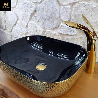 China Modern Luxury Crocodile Pattern Gold Black Gold Style Table Top Ceramic Luxury Bathroom Sinks Ceramic Hand Sink for sale