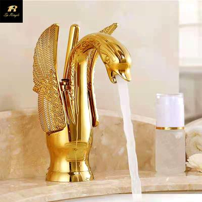 China Gold Plated Scratch Proof Bathroom Faucets Springle Metered Brass Mixer Cut Out Luxury Swan Deck Vanity Faucet for sale