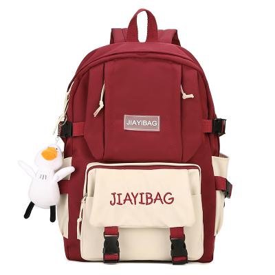 China Macaron School Bag Waterproof Nylon With New Kawaii Backpack Cute Pendant Waterproof Student Backpack Outdoor Travel Bag For School Girls for sale