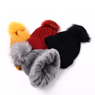 China New design Winter Hat Fashion Hairball Knitted Hat Outdoor Warm With Cashmere Wool Brim Plain Beanie Hat For Lady Casual for sale