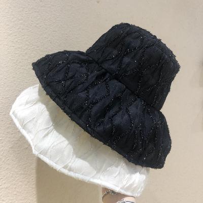 China Bright Silk Fisherman Hat Big Brim Traveling Sunscreen Bucket Hat Ladies Casual Fashion Black And White Hat for sale