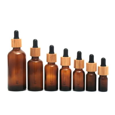 China Wholesale Cosmetic Bamboo Oil Dropper Bottle 5ml 10ml 15ml 20ml 30ml 50ml 100ml Serum Glass Essential Oil Dropper Bottle for sale