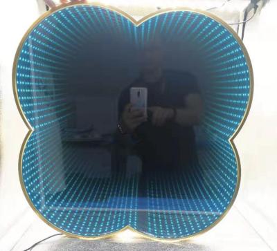 China Luxury Hotel Bathroom Infinity Custom Magnifying Irregular Decorative Wall Mounted Mirror With Led Strip for sale