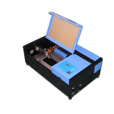 China Water Cooled CO2 40w 3020 Laser Cutting Machine 300*200mm For Phone Screen Protector for sale