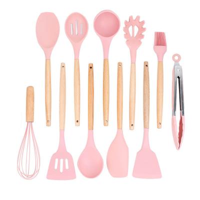 China Sustainable Silicone Pink Kitchen Utensils Cooking Tools Silicone Kitchen Utensils With Wooden Handle for sale