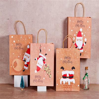 Китай Recyclable Christmas Gift Handbag Santa Elk Portable Gift Paper Bag With Handle Exquisite Christmas Candy Packaging Bag продается