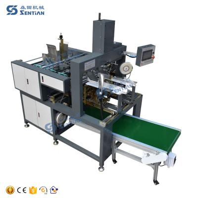 China Items Wy-65 Plc Control Table Gluing Machine 4 Corner Box Corner Pasting Gluing Machinery for sale