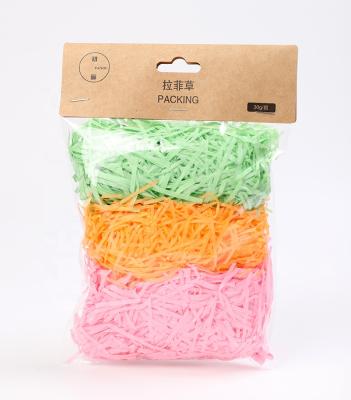 China ANTISTATIC decorative gift filled raffia thin paper color shredded paper filling shredded paper for sale