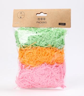 China ANTISTATIC Colored Raffia Gift Box Filler Decoration Shredded Paper Fold Cut Shred Paper Packaging for sale