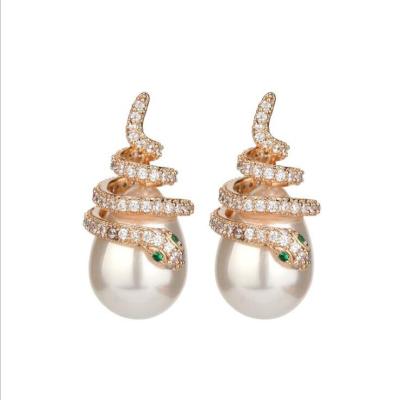 China Fashionable temperament ladies snake cute simple gold plated rhinestone curved pearl earrings jewelry for women for sale