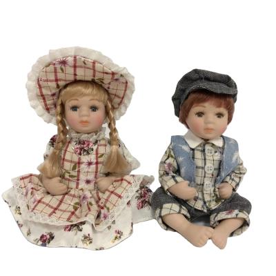 China DIY PLAY Nice Cloth Couples Porcelain Doll High Quality Dress With Sitting Position for sale