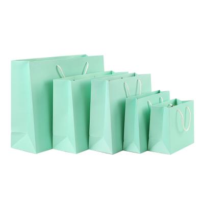 China Wholesale Bright Color Clothing Gift Biodegradable Hot Selling Small Fresh Gift Packaging Portable Kraft Paper Bag for sale