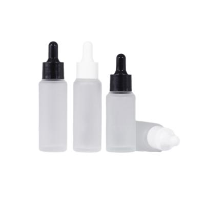 China Personal Care Cylinder Shape Essential Oil 30Ml Dropper Bottles Glass Flat Shoulder Frosted Thick Bottom for sale