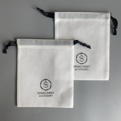 China Recyclable Customized White Jewelry Packing Gift Nonwoven Bag With Ribbon Nonwoven Drawstring Bag With Logo for sale