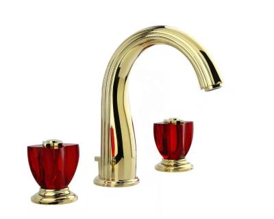 China Lotus Series Royal Gold Dual Crystal Handle 3 Hole Metered Deck Mounted Basin Brass Separate Faucet for sale