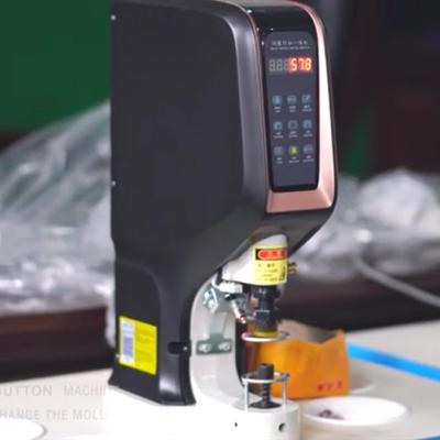 China Garment Shops Semi-Automatic Button Attaching Button Cover Machine Buckle Stitching Machine Baseball Cap making Machine for sale