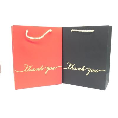 China Recyclable Gold Paper Cardboard Folding Hot Stamping Gift Bags For Party Packaging Bag Gift Box for sale