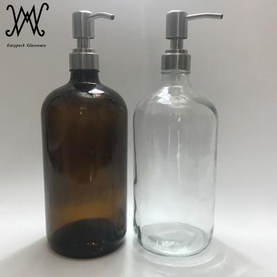 China Personal Care 32oz 1000ml Clear Amber Boston Round Glass Bottle With Stainless Steel Lotion Soap Dispenser for sale