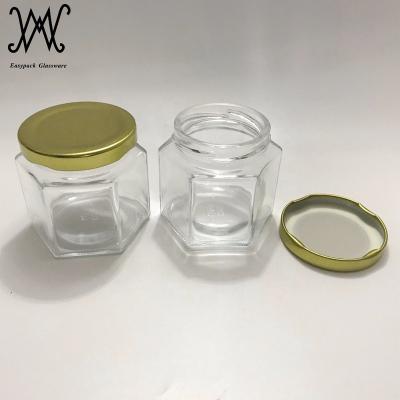 China Freshness Preservation 4oz Hexagonal Glass Jar With Gold Metal Lid High Quality For Honey Jam Home Made for sale