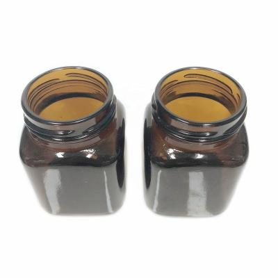 China Personal Care 170ml 150ml 5oz Square Shaped Amber Glass Jars With Tinplate Metal Lid Hook Cap For Food Storage Packaging for sale