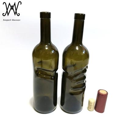 China Dark Green Beverage 750ml Angel Hand Glass Wine Bottle With Cork Lid for sale