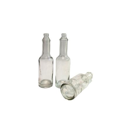 China Food 60ml 2oz Clear Glass Bottles For Hot Sauce Original Red Pepper Sauce With Lid for sale