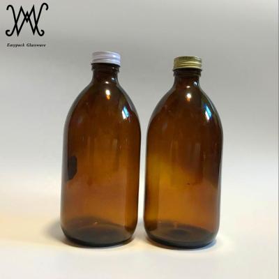 China 500ml Round Shape Glass Pharmaceutical Empty Amber Pharmaceutical Syrup Bottle With Metal Lid for sale