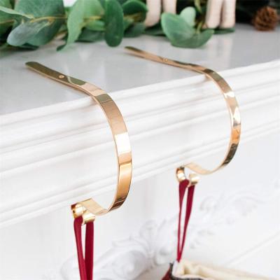 China Gold Metal Design Non-slip Christmas Stocking Holder Hanger Hooks Fireplace S Style for sale