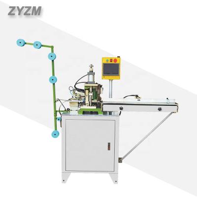 China Full-automatic open zipper cutting machine from zhenyu zipper machinery factory Te koop