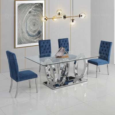 China Modern Dining Furniture Glass Top Dining Table Sets 6 Chairs Metal Stainless Steel Glass Dining Tables for sale