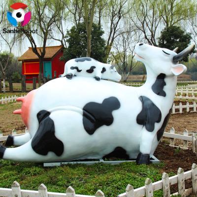 China Wholesale 100%response Fiberglass Dairy Cows Statue Realistic Animals Porcelain Farm Cow Milking Movement For Decorative Park for sale