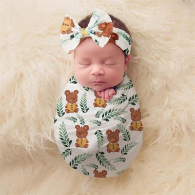 China Disposable baby swaddle swaddle 100% cotton with hat New design 100% cotton swaddle baby set sleeping bags for sale