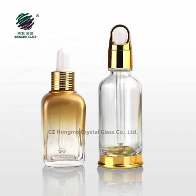 China Wholesale 50ml Round 50ml Gold Material Recyclable Square Glass Bottle Luxury Matte Dropper Bottles For Essential Oil Personal Care Serum Packaging for sale