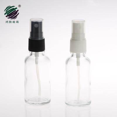 China Wholesale Recyclable Material Transparent Cosmetic 1oz Spray Bottle 30ml Empty Essential Oil Glass Bottle With White Black Sprayers for sale