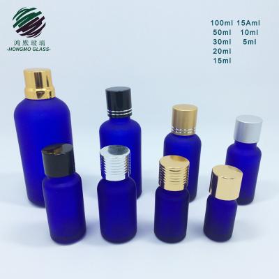 China Recyclable Material Acid Etching Frosted Cobalt Blue Essential Oil Glass Bottle With Dropper for sale