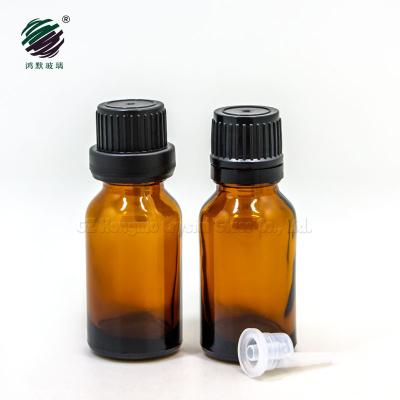 China 15ml 1/2 oz cosmetic serum amber glass bottle with black plastic cap and dropper cap for essential oil packaging for sale