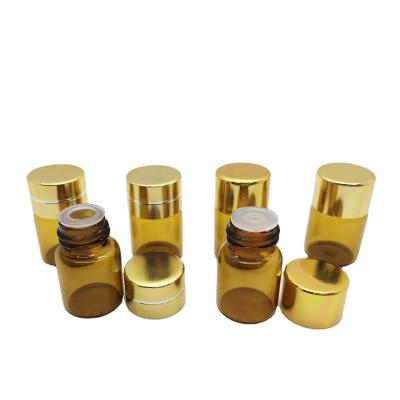 China Recyclable Mini Cosmetic 2ml Amber Material Essential Oil Vial Glass Bottle With Reducer Plug And Screw On Aluminum Caps for sale