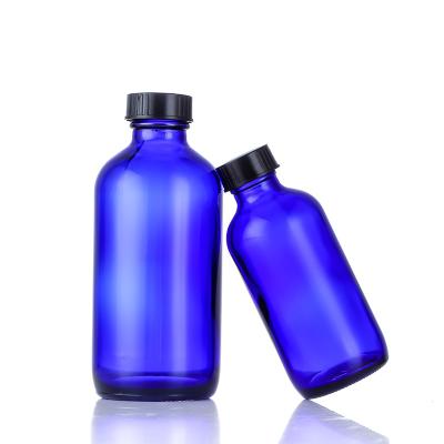 China 16 oz Cobalt Blue Boston Glass Cosmetic Refillable Bottle Boston Round Bottles With Black Poly Cone Cap for sale