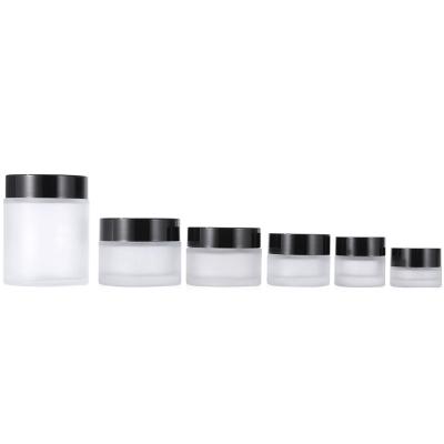 China Cosmetic 1 Ounce Frosted Glass Empty Face Cream Jar 5g 10g 15g 20g 50g 100g Custom Cosmetic Jar With Black Lids for sale