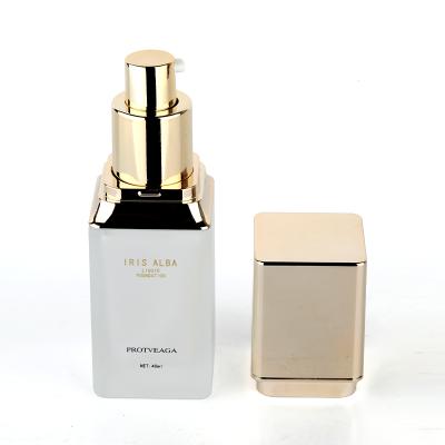 China Luxury Square White Empty Unique Glass 30ml Personal Care Serum Pump Bottles Glass Lotion Pump Bottles With Square Gold Lid for sale