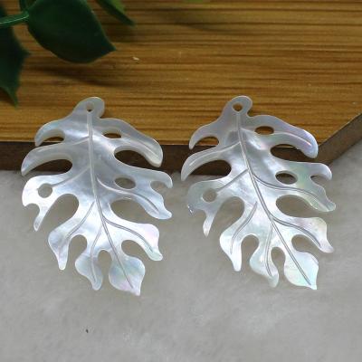 China Color Play or Fire 24*35mm Black White Pearly Leaf Charms Cutout Tropical BROOM Shell Monstera Leaf for sale