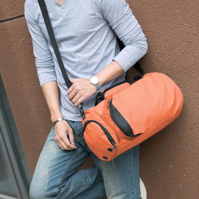 China Outdoor sports simple stylish multi-functional waterproof nylon gym bag orange fitness duffel bag for sale