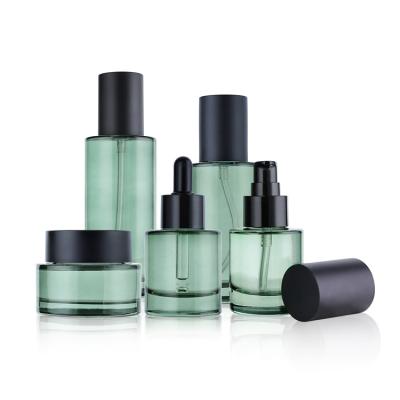 China Cosmetic Porcelain Made Round Skin Care Packaging Toner Emulsion Eye Cream Serum Men Glass Bottles Cosmetic Set for sale