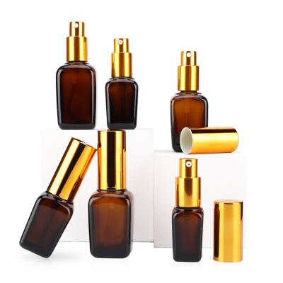 China Luxury OEM Personal Care 10 Square 20 30 50 100ml Perfume Essential Oil Packaging Amber Pump Spray Glass Bottle With Gold Lid for sale