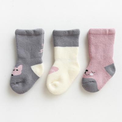 China Breathable popular combed cotton baby socks in the new autumn/winter thickened cartoon hosiery for the baby for sale