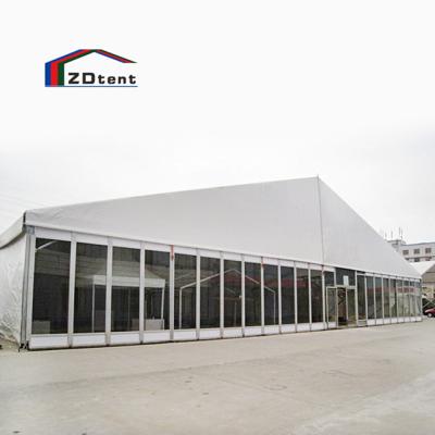 China Large Span Wall Glass Marquee Weather Resistant Outdoor Clear Transparent Snow Proof Aluminum Warehouse Tent Storage for sale