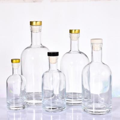 China Wholesale Inventory 200ml 375ml 500ml 750ml 1000ml Transparent Empty Beverage Glass Bottle For Vodka Liquor Wine With Cork Stopper Cap for sale