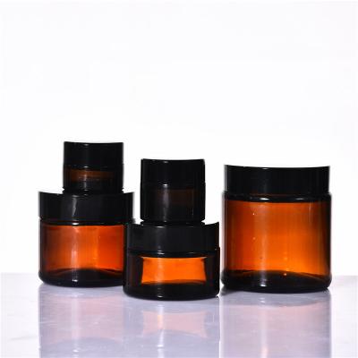 China Customization 5g 10g 15g 20g 30g 50g 60g 100g Cosmetic Wholesale Amber Glass Jar Eye Cream Skin Cream Jar With Lids for sale