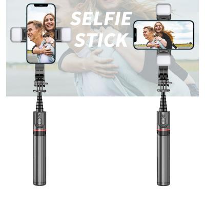 China Fold Up Wireless Tripod Front And Back Fill Light Reinforcement Bracket Selfie Stick For Smartphone for sale