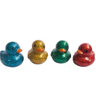 China Bath Toy 2021 Hot Selling Small Vinyl Material Bath Duck Toy With Glitter for sale